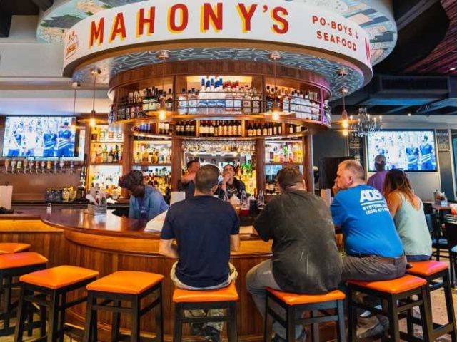 Patrons seated at bar at Mahony's Restaurant